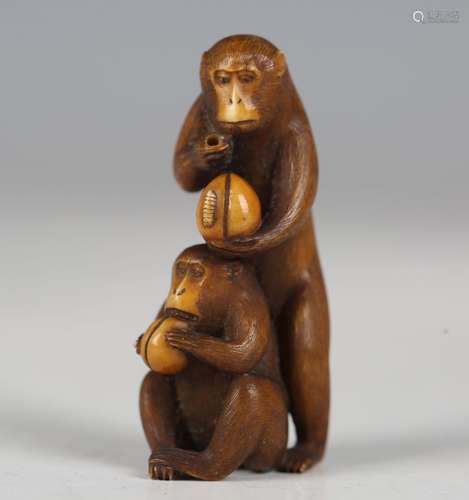 A Japanese carved and stained ivory okimono netsuke, Meiji p...