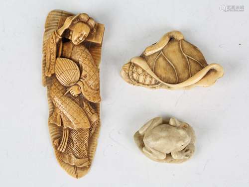 A Japanese carved and stained ivory netsuke, Meiji period, f...