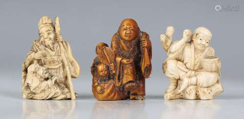 A group of seven Japanese carved ivory okimono netsuke, Meij...