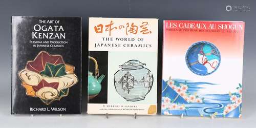 A collection of Japanese art reference books, including 'Les...