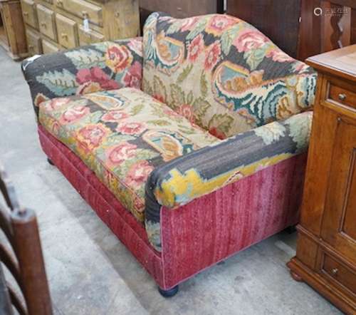An early 20th century carpet upholstered scroll arm two seat...