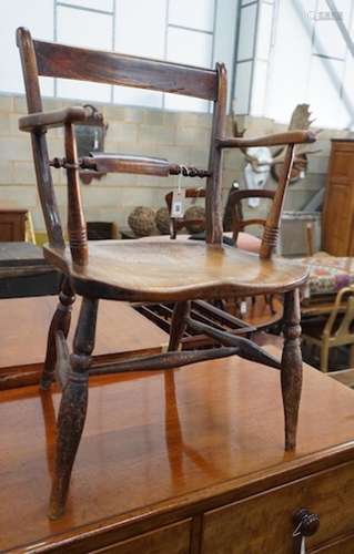 A Victorian elm and beech Windsor elbow chair, width 50cm, d...