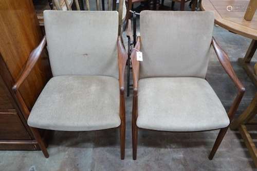 A pair of mid century teak upholstered elbow chairs, width 5...