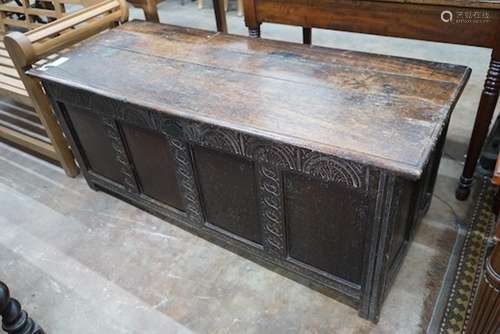 An 18th century and later carved panelled oak coffer, width ...