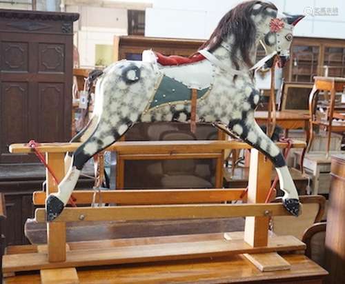 A vintage Ayres type dapple grey carved wood rocking horse o...