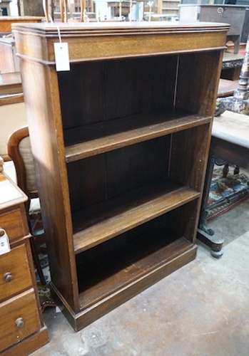 An Edwardian oak open bookcase, length 78cm, width 25cm, hei...