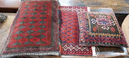 Two Caucasian cushions, larger 67 x 45cm together with a bag...