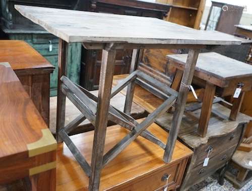 A provincial rectangular pine occasional table on folding st...