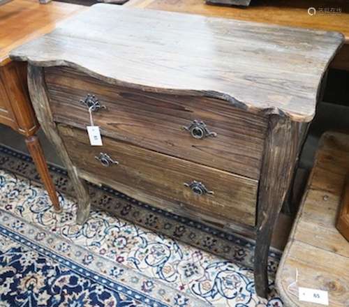 An 18th century style French provincial pine two drawer comm...