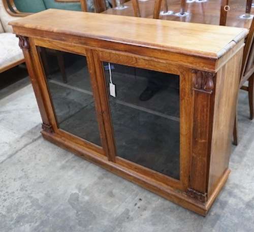 A Victorian and later faded rosewood two door bookcase, widt...