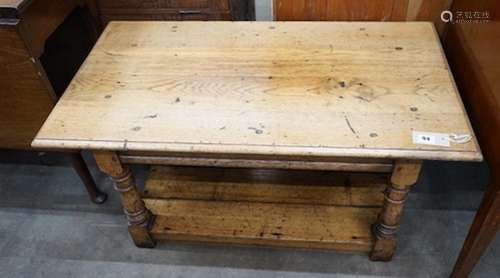 An 18th century style pale oak two tier coffee table, length...