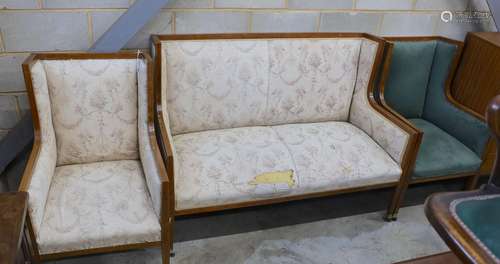 An Edwardian inlaid mahogany three piece salon suite, settee...