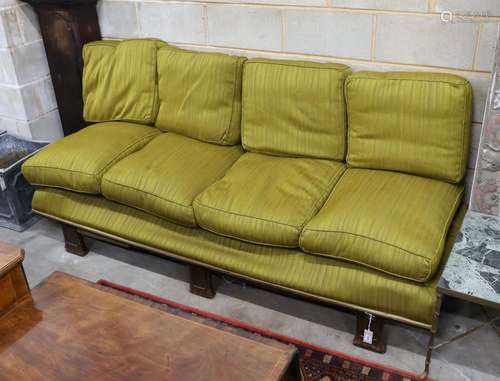 An early 20th century Continental mahogany day bed with loos...