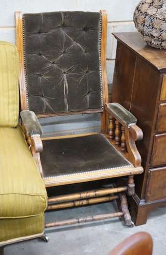 An early 20th century American upholstered mahogany rocking ...