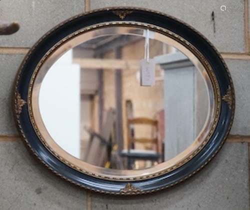 An painted gilt framed oval mirror, width 60cm, height 50cm