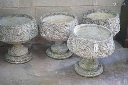 A matched set of four circular reconstituted stone garden pl...