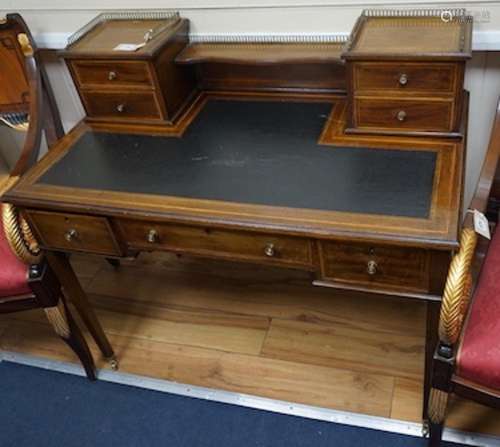 An Edwardian satinwood banded mahogany kneehole writing desk...