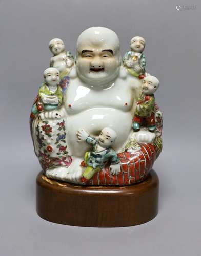 A Chinese enamelled porcelain Budai group, Republic period, ...