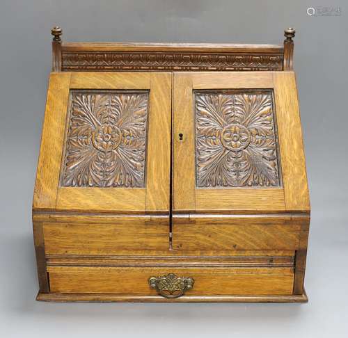 An Edwardian oak stationary box 36cm