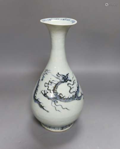 A Chinese blue and white ‘dragon’ bottle vase 25cm