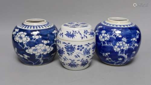 Two 19th century blue and white prunus jars and a barrel jar...