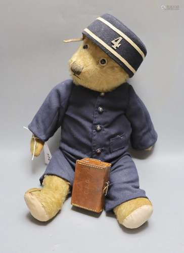 A Chiltern teddy bear dressed as railway porter, replaced fo...