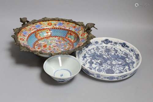 A Chinese clobbered dish with bronze mount, a Chinese blue-a...