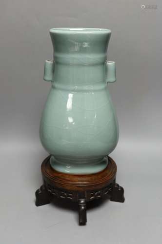 A Chinese celadon glazed arrow vase on a stand 35cm total he...