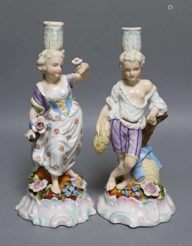 A pair of 19th-century Sitzendorf porcelain candlestick figu...