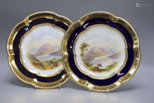 A pair of Coalport plates painted with Scottish loch scenes,...