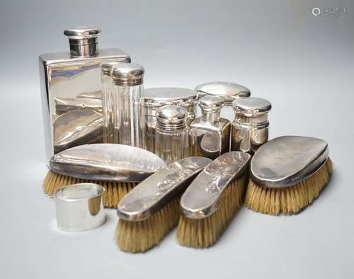 Six assorted George V silver mounted glass toilet jars, a si...