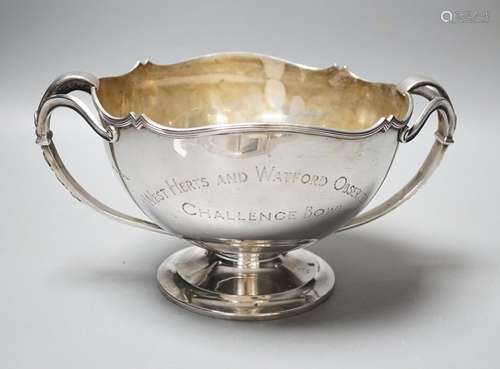 A George V silver two handled presentation pedestal bowl, wi...