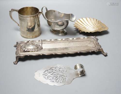 A George V silver sauceboat, an Edwardian silver pen tray an...