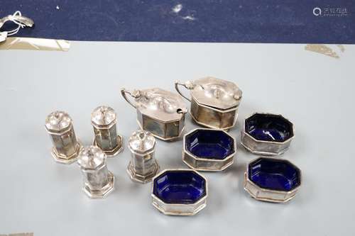 A George V ten piece octagonal silver condiment set, James D...