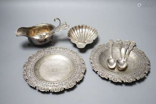 A late Victorian silver butter shell, a later silver saucebo...