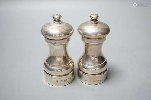 A modern pair of silver mounted salt and pepper mills, 10.4c...