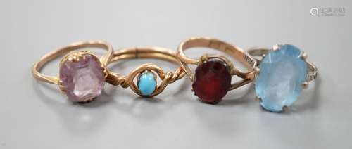 Two 9ct dress rings and two other rings including gilt metal...