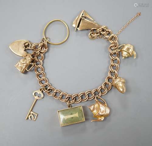 A 1960s 9ct gold charm bracelet, hung with eight assorted ma...