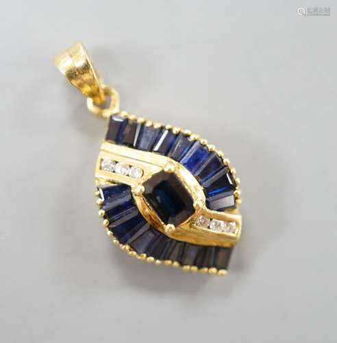 A modern gold, sapphire and diamond cluster set oval pendant...