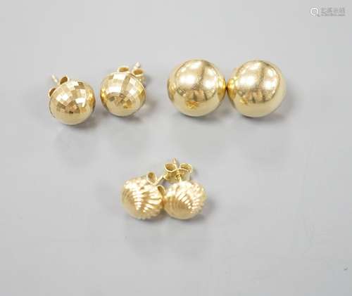 Two modern pairs of 750 yellow metal ear studs, one with 925...