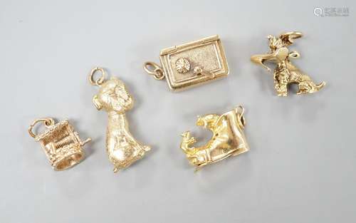 Five assorted modern 9ct gold charms, including a well, safe...