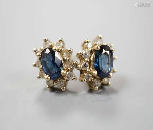 A pair of modern 9ct gold, sapphire and diamond chip set ova...