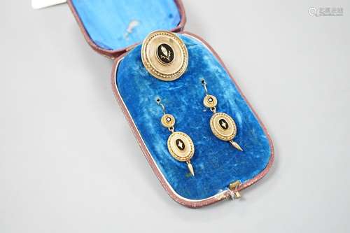 A cased Victorian yellow metal, black enamel and seed pearl ...