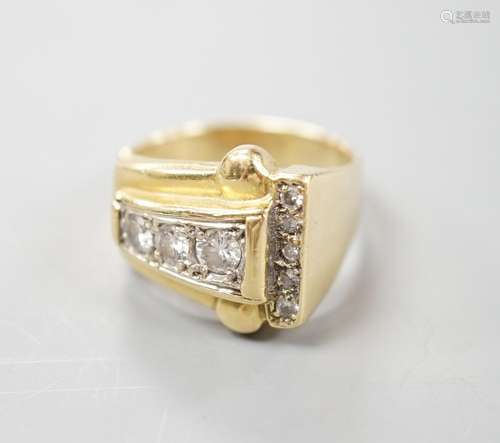 A 1950s yellow metal and graduated eight stone diamond set d...