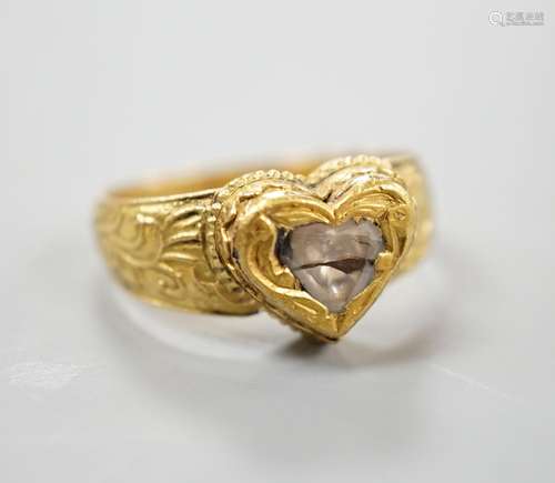 An Indian yellow metal and heart shaped diamond set ring, wi...