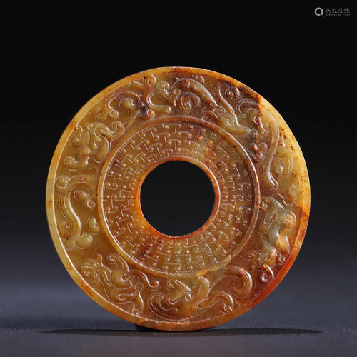 A Chinese Carved Russet Jade Disc Bi Han Dyn.