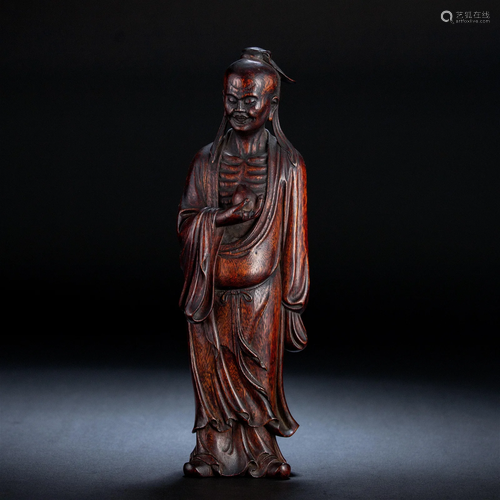 A Chinese Carved Aloes-wood Standing Figure Qing Dyn.