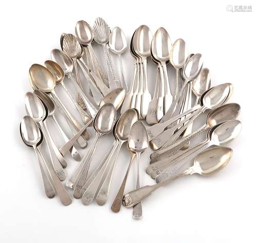 A large collection of silver teaspoons, various patterns, da...