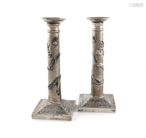 A pair of Chinese silver candlesticks, retailed by Wang Hing...