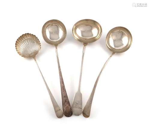 A collection of four antique silver soup ladles, comprising:...